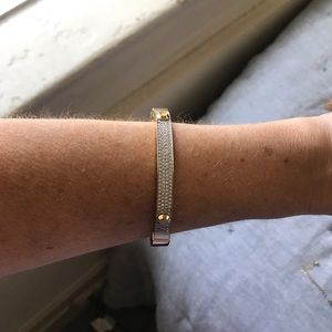Michael Kors gold/studded bracelet.